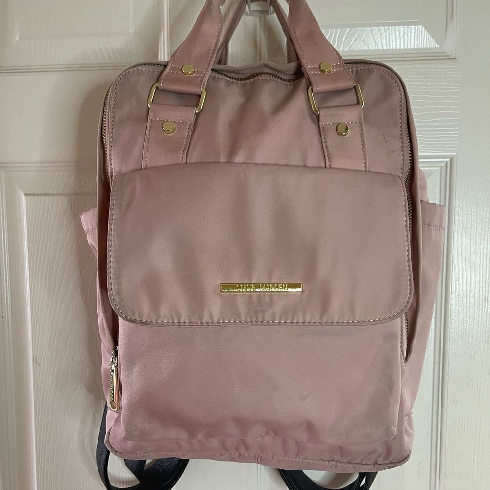 Steve Madden Nylon blush pink backpack with black embroidery back straps.